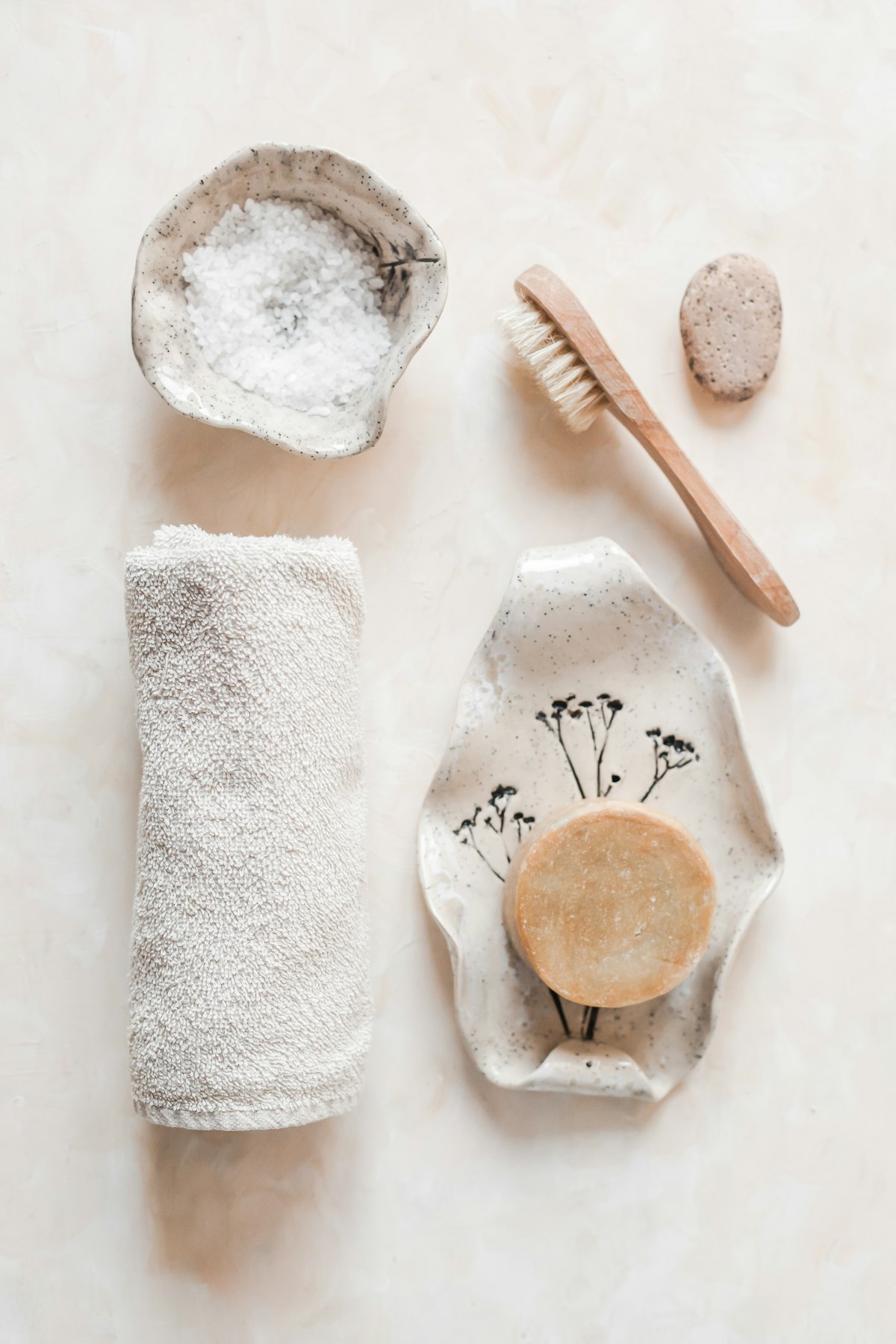 Rose quartz gua sha facial sculpting tool and calming nighttime botanical oil